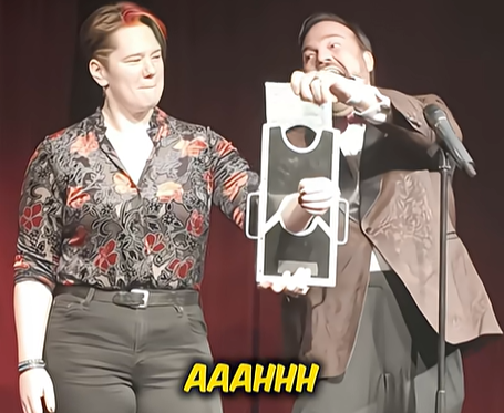 Matt Donnelly magic show yelling as it looks like he will cut off an audience member's arm