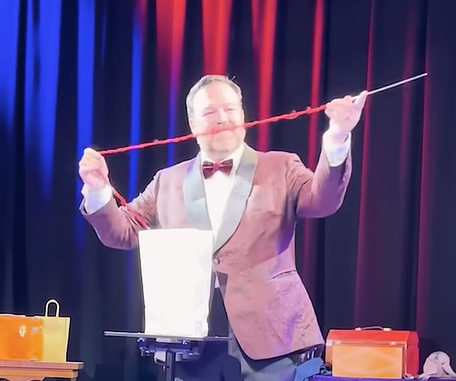 Matt Donnelly prepares Cupid's arrow for a trick